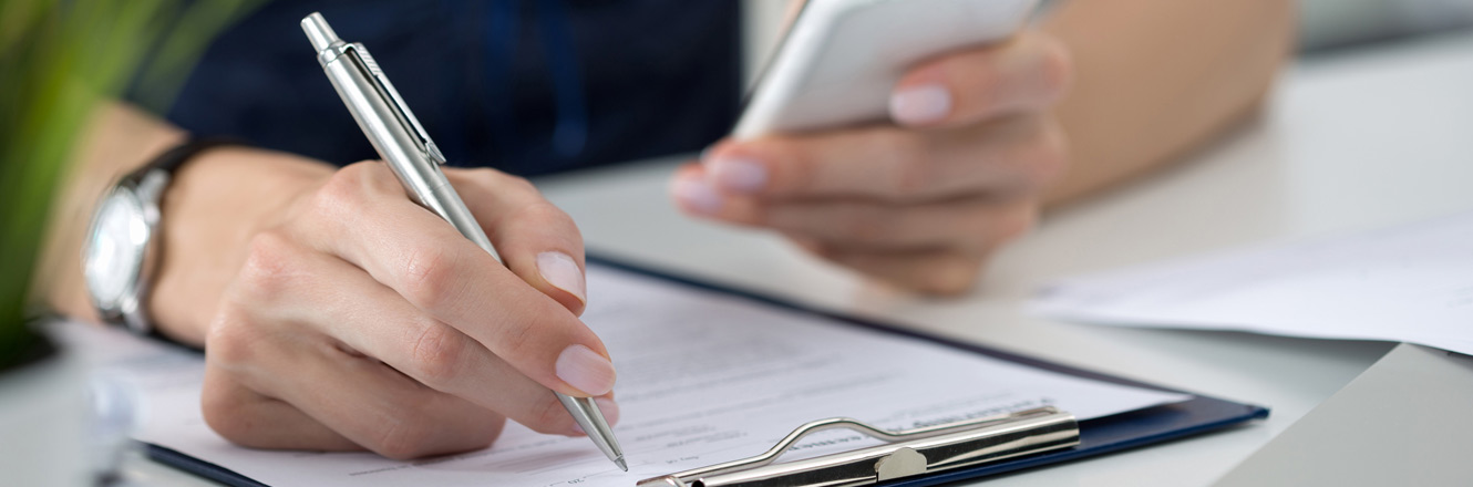 Person writing a check